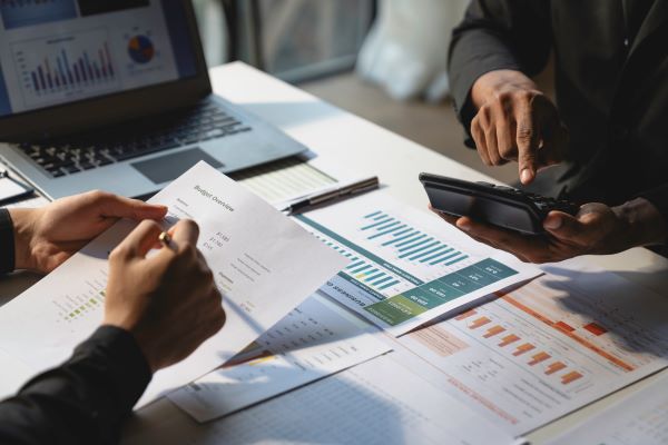 People figuring out closing costs on home.